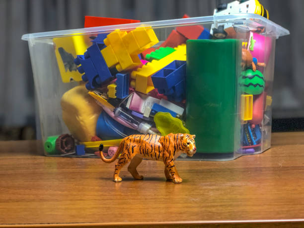 istock box with children's toys on the table during games 1089489554