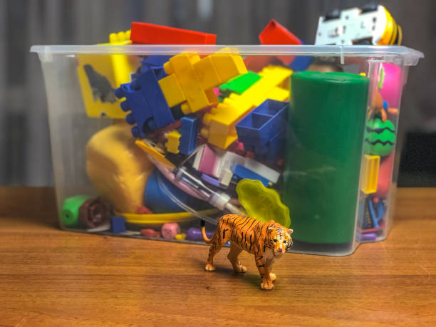 istock box with children's toys on the table during games 1089489570
