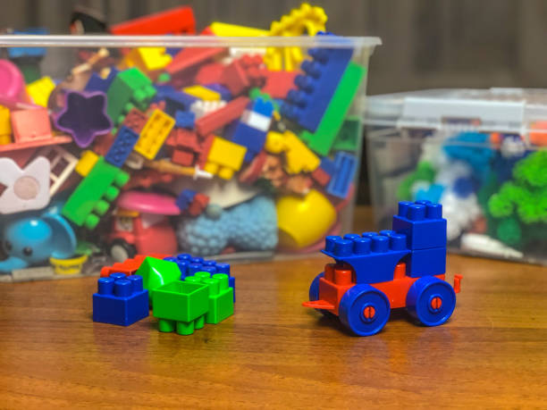 istock box with children's toys on the table during games 1089489808