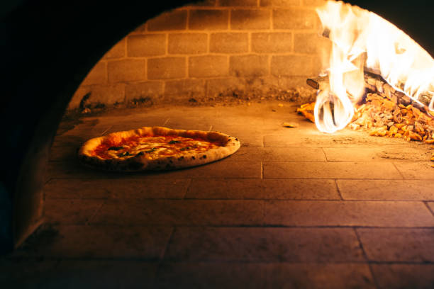 istock Traditional style of a pizza oven with a pizza 1089491100