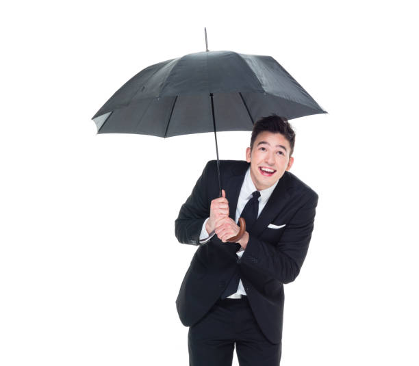 istock Handsome businessman holding an umbrella 1089491466