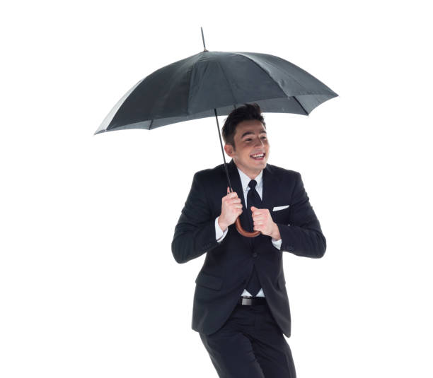 istock Handsome businessman holding an umbrella 1089491472