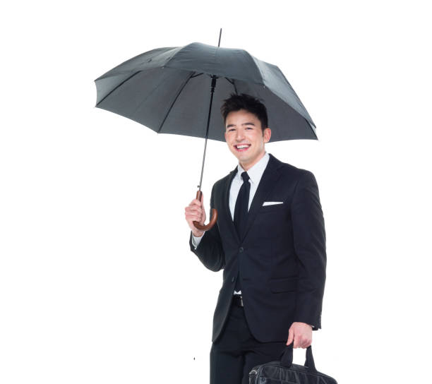 istock Handsome businessman holding an umbrella 1089491526
