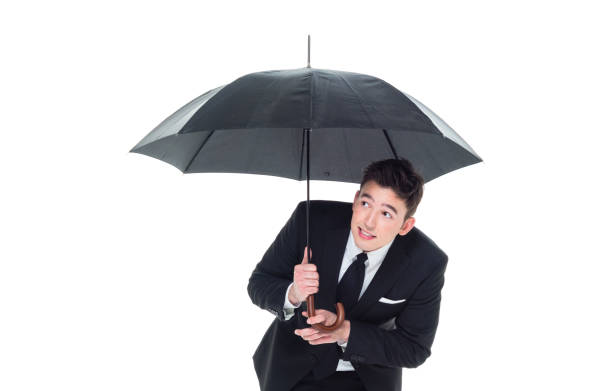 istock Handsome businessman holding an umbrella 1089491588