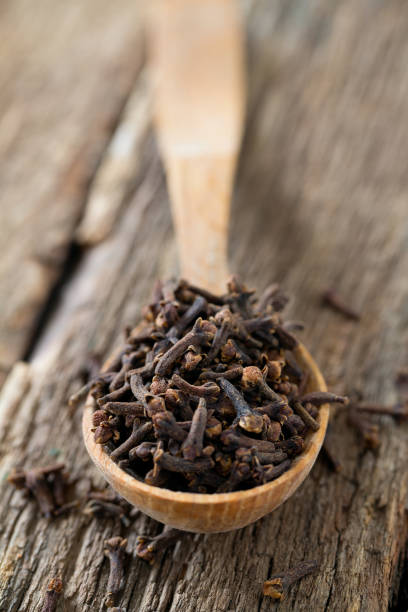 istock cloves in a wooden spoon 1089493474
