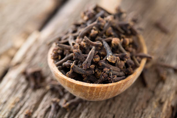 istock cloves in a wooden spoon 1089494118