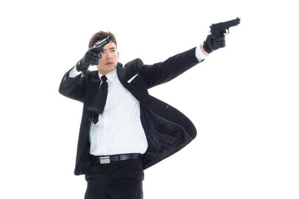 istock Handsome businessman holding a handgun 1089494620