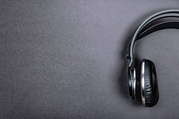 istock Black professional headphones on a dark silver background. 1089496994