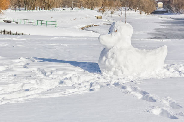 istock Snow duck sculpture in the winter park 1089500058