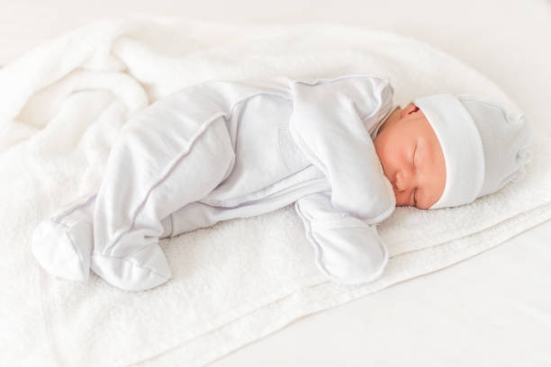 istock Sleepy baby close-up in a baby cot. 1089501944