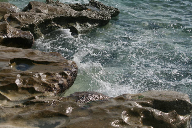 istock Big rocks in the sea water 1089508456