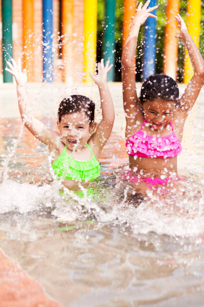 istock Girls playing in pool very happy 1089517242