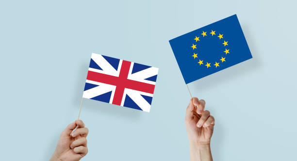 istock Great Britain and European Union flags kept in hands. 1089519582