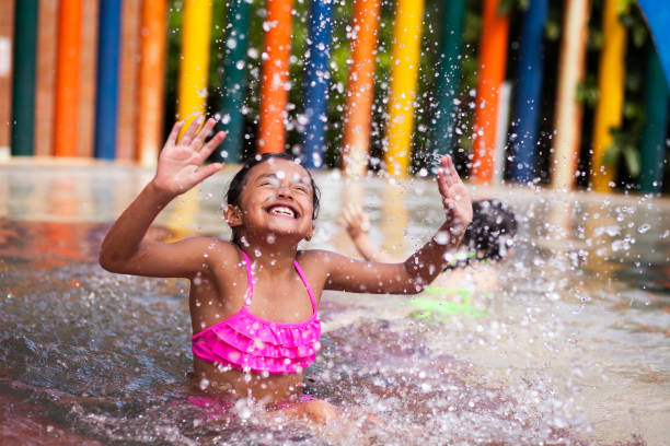 istock Little Girl playing alone in the pool 1089521010