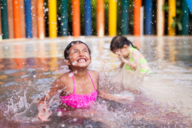 istock Little Girl playing alone in the pool 1089521054