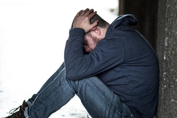 istock Homeless Depressed Man Sitting in Cold Subway Tunnel 1089522788