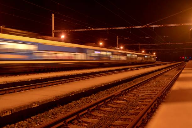 istock High speed passenger train on tracks with motion blur effect at night. Railway station in the Czech Republic 1089522862