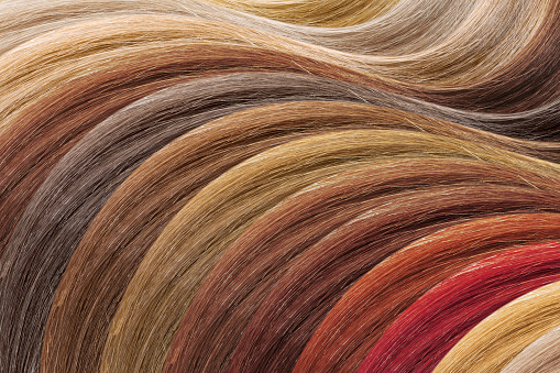 Paleta de colores de cabello como fondo. Muestras teñidas photo