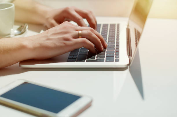 istock Businessman working laptop for new architectural project. Generic design notebook on the table. Young businessman working with laptop at office. Unrecognizable man using a modern portable computer 1089539928