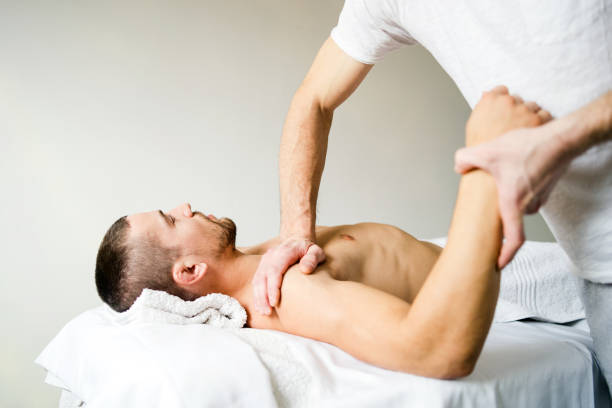 istock Young Man Having Massage At Spa in order to speed up recovery 1089545578