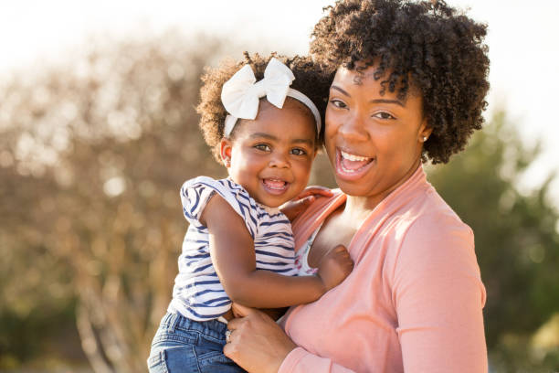 istock African American mother picking up her daughter. 1089551204