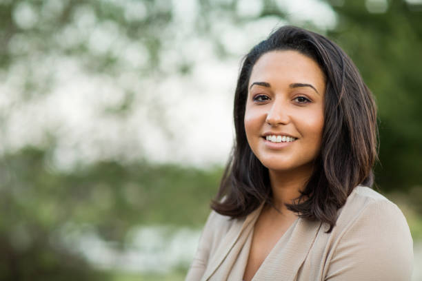 istock Confident woman smiling outside. 1089556078