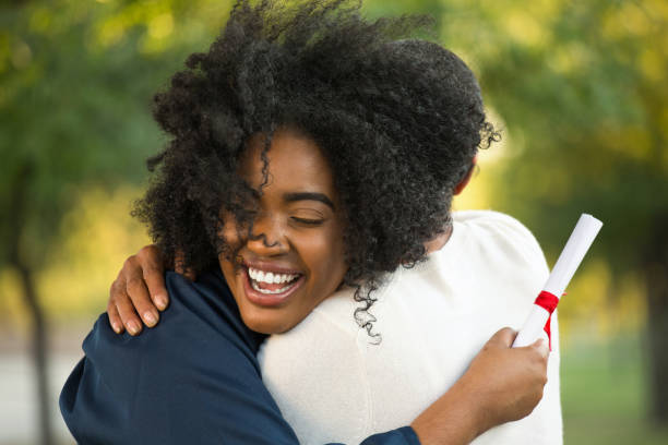 istock Mother and her daughter hugging at her graduation 1089556194