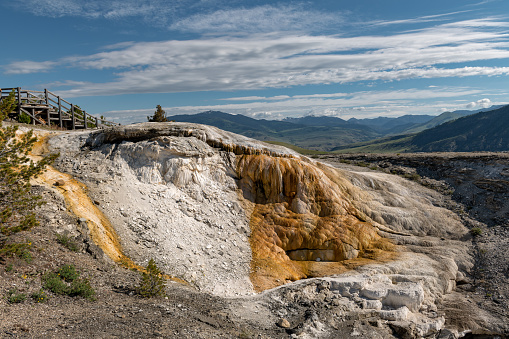 Mammoth Hot Springs is a large complex of hot springs on a hill of travertine in Yellowstone National Park. Wyoming, USA