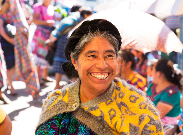 Antigua, Guatemala- December 2018: Indigenous woman portrait smiling at the market in a village at the outskirts of Antigua.
