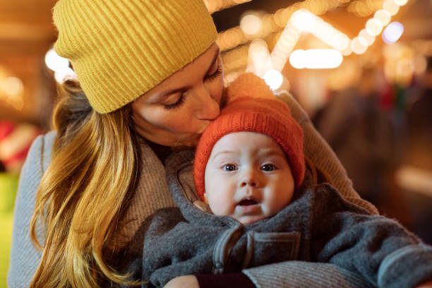 istock Mother kissing a baby 1089596736