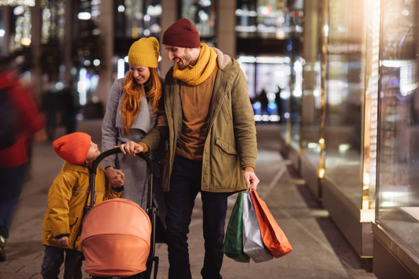 istock Parents with a boy and a baby in a stroller 1089596800
