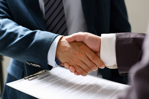 istock Man in suit shake hand as hello in office closeup 1089611534