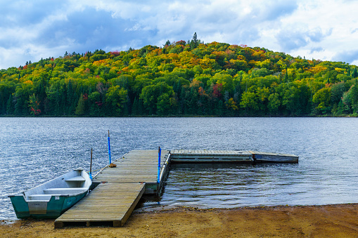 Boat and pier in Petit Lac Monroe, Mont Tremblant NP, Quebec, Canada