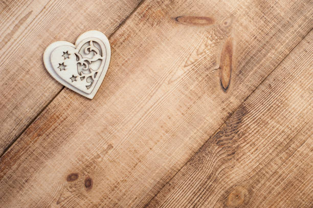 istock Wood heart placed nicely on a vintage wooden background. 1089619202