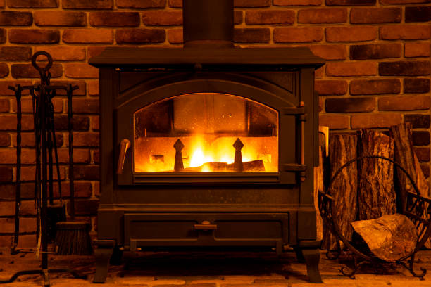 istock Firewoods burn in a fireplace before a brick wall in winter. 1089627730