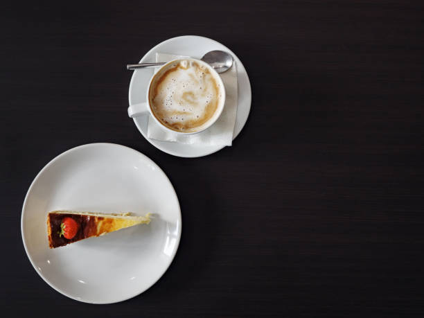 istock Cup of latte coffee with cheesecake 1089633962