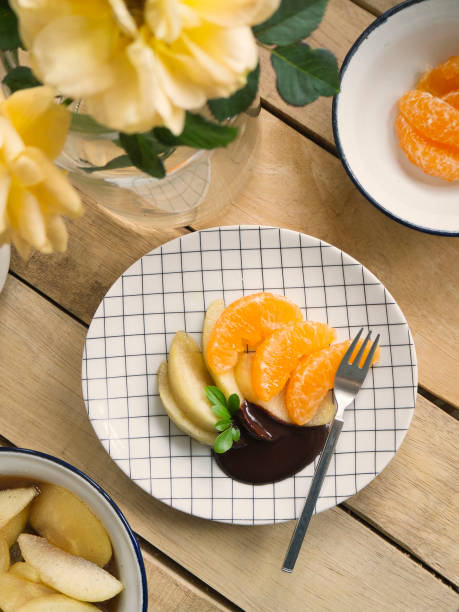istock poached apples & fresh oranges with chocolate sauce 1089638254