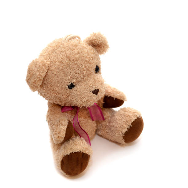 istock Teddy bear with a red bow on her neck on an isolated background 1089639730