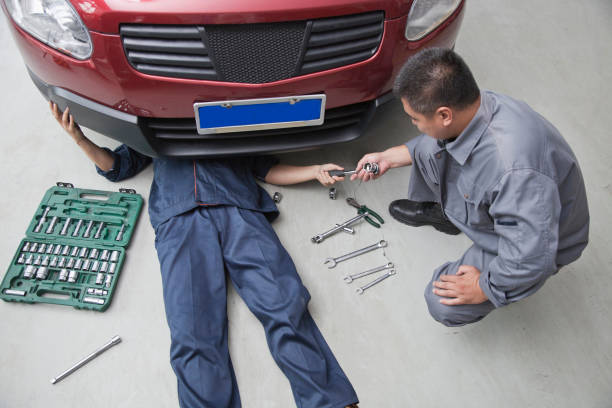 istock Chinese mechanics working in garage 1089643596