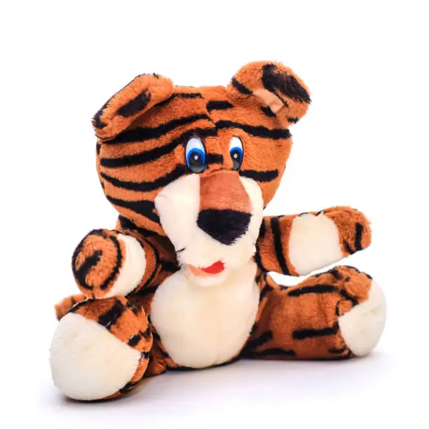 Photo of Soft toy striped tiger on white background