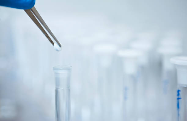 Close-Up Of Colorful Chemicals In Laboratory Glassware On Table