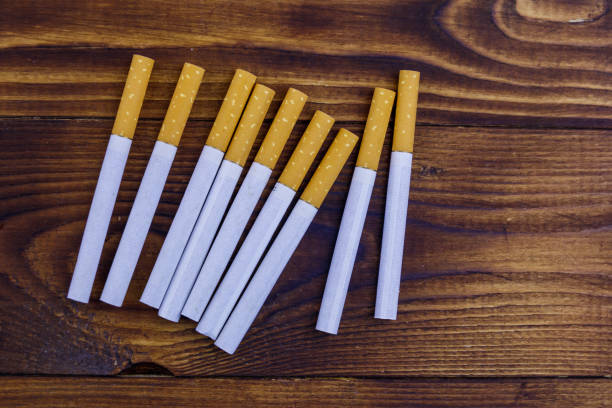 istock Tobacco cigarettes on wooden table 1089645766