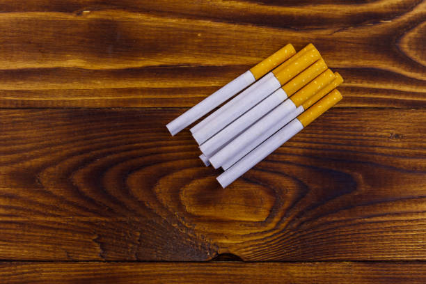 istock Tobacco cigarettes on wooden table 1089645768