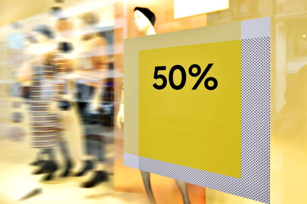 50% sale discount poster at store window-glass.