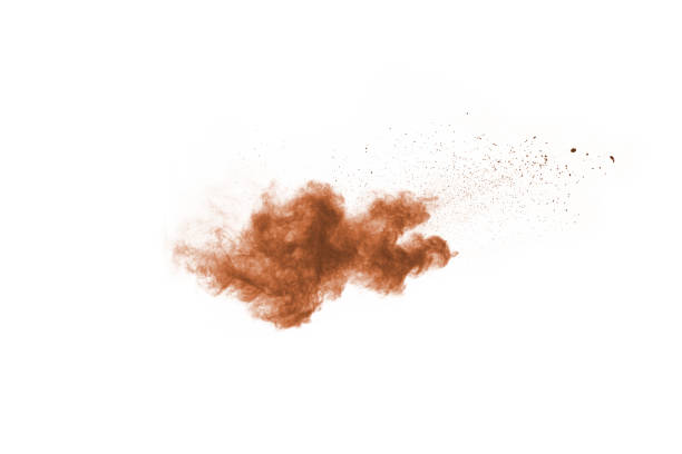 istock Brown color powder explosion on white background. Colored cloud. Colorful dust explode. Paint Holi. 1089655664