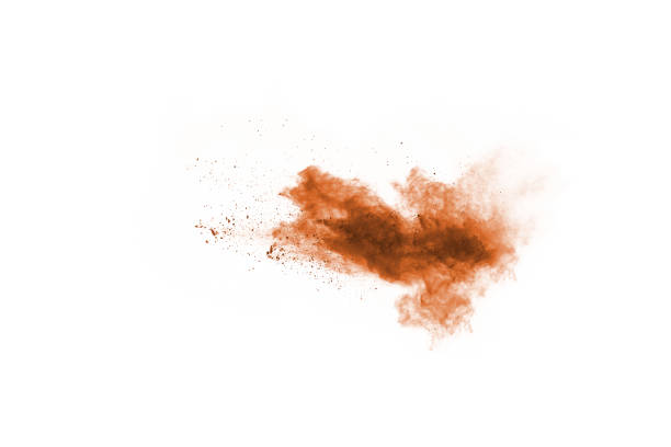 istock Brown color powder explosion on white background. Colored cloud. Colorful dust explode. Paint Holi. 1089655774