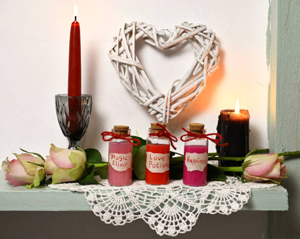 istock Red and black candles, roses, heart symbols, bottles with magic elixir, love potion, happiness 1089660874