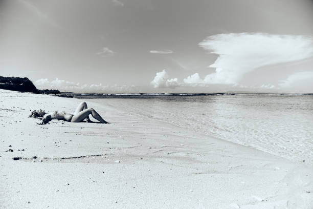 istock Slim woman enjoying on a sandy tropical beach. 1089662058