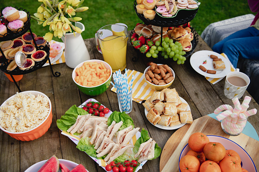 High angle view of a table outdoors with a variety of different foods on it.