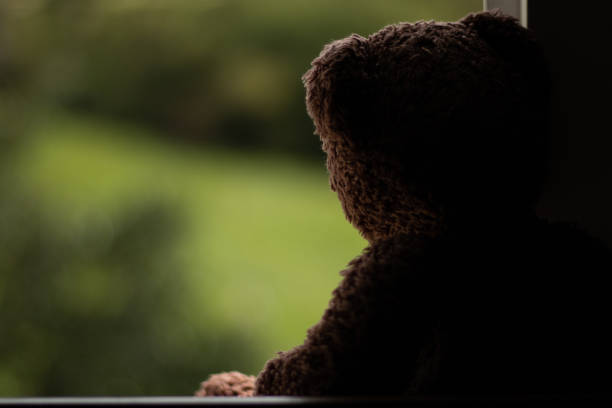 istock teddy bear kuddy toy window 1089662734